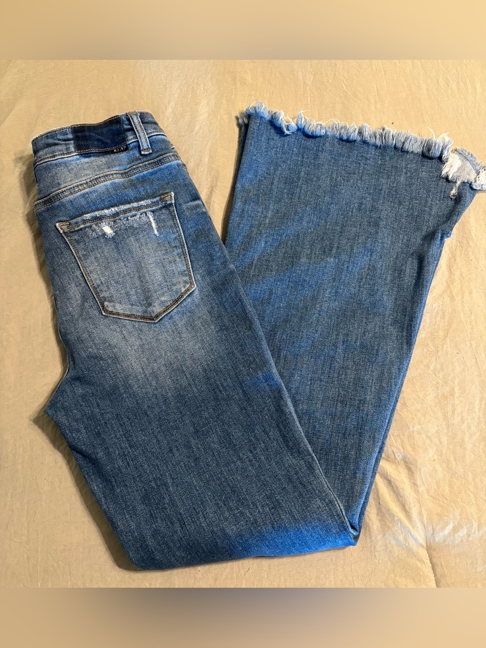 Frayed-Hem Flare Jeans in Medium Wash